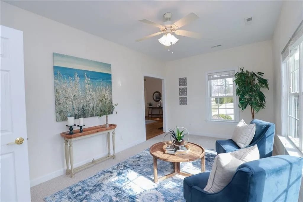 sitting room with 2 blue chairs