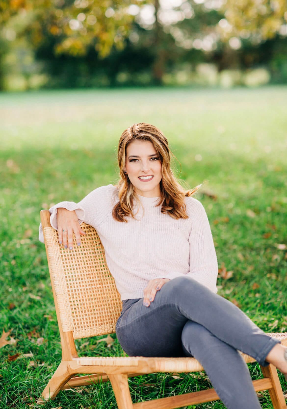 Woman sitting in a chair on grass